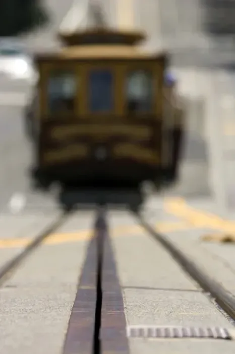 Framed Print : Ground level view of an approaching San Francisco cable car