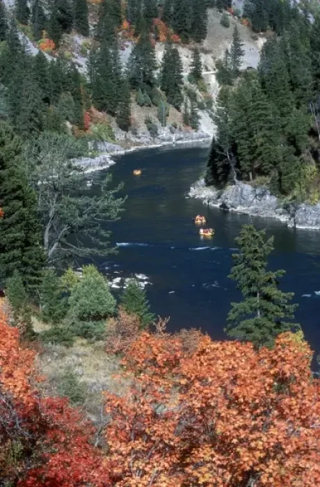Framed Print : A group of rafts floating down a river in autumn