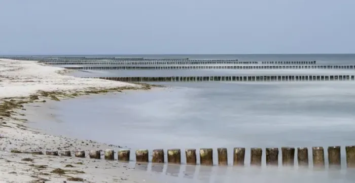 Framed Print : Groynes are protecting the coast outside the full protected Wilderness Area in