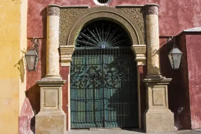 Framed Print : Guatemala, Antigua. Ornate door with gate in the town of Antigua