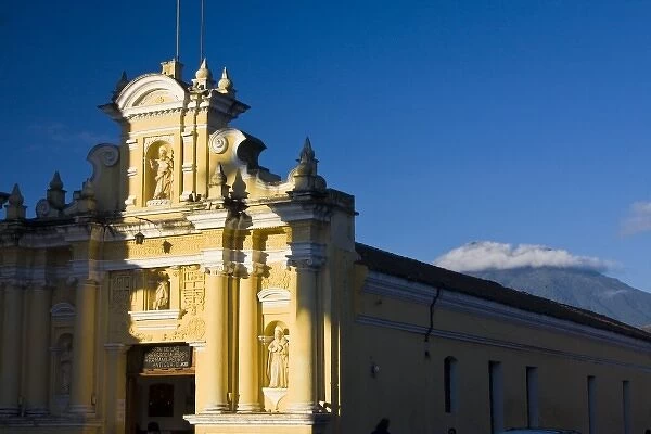 Guatemala, Antigua. San Pedro Church in the town of Antigua and Vulcan de Agua