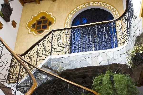 Guatemala, Antigua. Stairway leading to rooms of small boutique hotel in Antigua