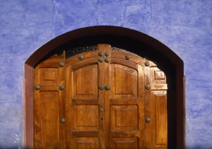 Framed Print : Guatemala, Antigua, Detail of wooden doorway and brightly painted walls of colonial
