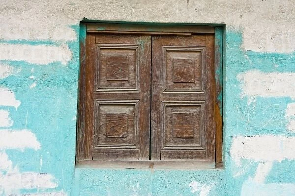 Guatemala, Chichicastenango. Closed wooden windows in the town of Chichicastenango