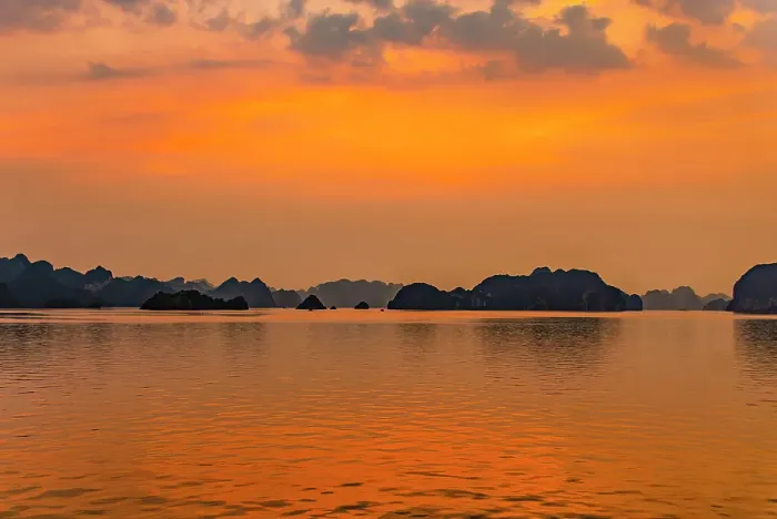 Framed Print : Ha Long Bay, Vietnam. Wide angle landscape view of fishing boats at sunset among the limestone karsts and islets of the UNESCO Heritage Site