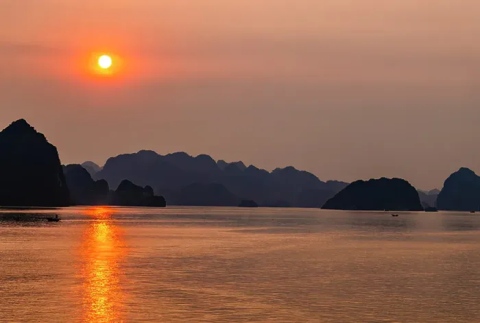 Framed Print : Ha Long Bay, Vietnam. Wide angle landscape view of fishing boats at sunset among the limestone karsts and islets of the UNESCO Heritage Site