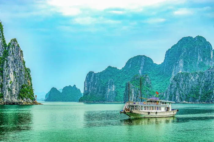 Framed Print : Ha Long Bay, Vietnam. Wide angle landscape view of tourist boat among the limestone karsts and islets of the UNESCO Heritage Site