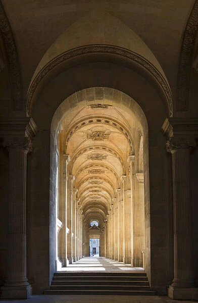 Hallway to the pyramid and courtyard at the Louvre in Paris, France