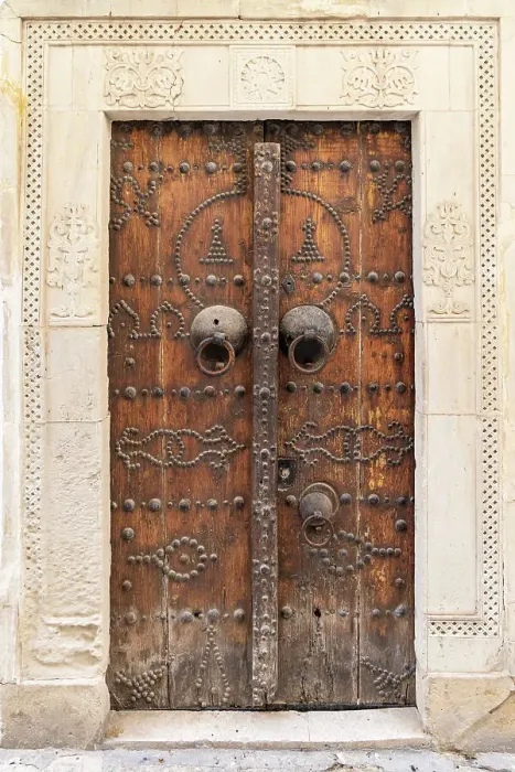 Framed Print : Hammamet, Nabeul, Tunisia. A decorated wooden door on a building Framed Print : Hammamet, Nabeul, Tunisia. A decorated wooden door on a building