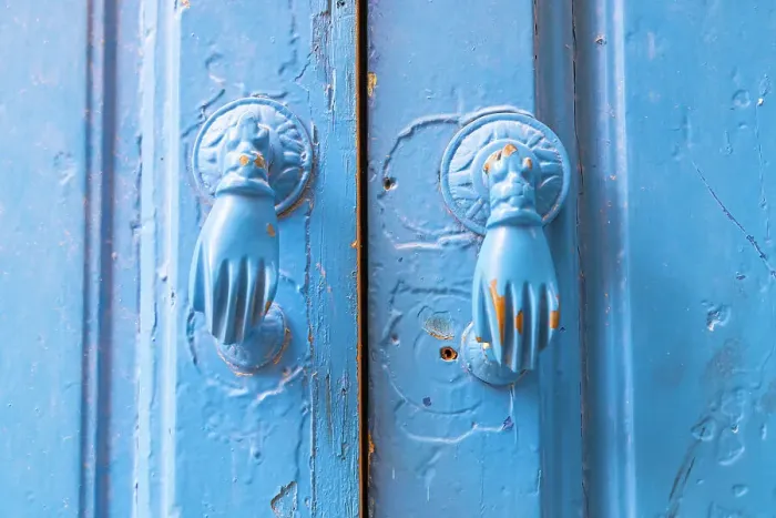 Framed Print : Hammamet, Nabeul, Tunisia. Hand shaped door knockers on a blue painted door Framed Print : Hammamet, Nabeul, Tunisia. Hand shaped door knockers on a blue painted door