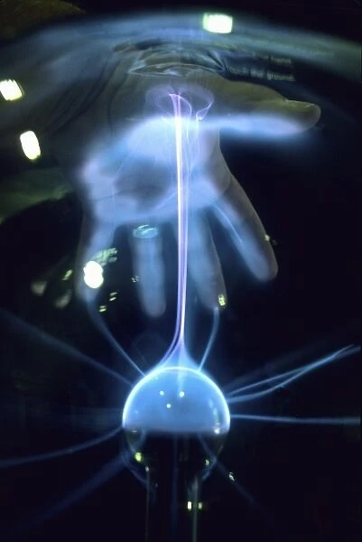 Hand creating static electricity arc in plasma ball, Duke Power Energy Exploratorium