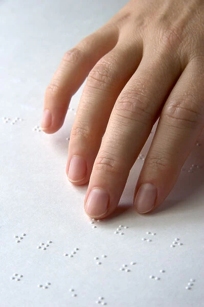 Hand reading braille