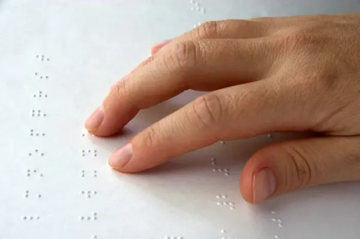 Framed Print : Hand reading braille Framed Print : Hand reading braille
