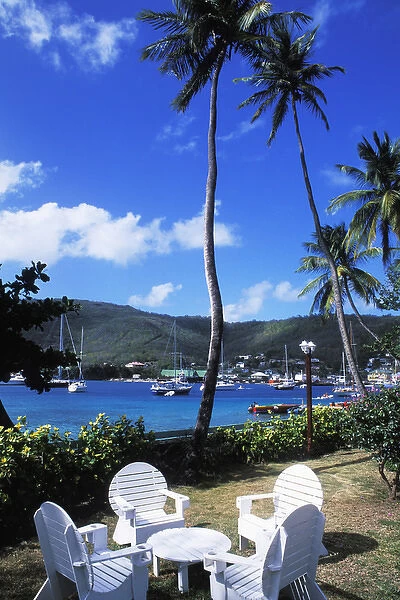 Harbor, palms, blue water, chairs at Port Elizabeth in Bequia, Grenadines