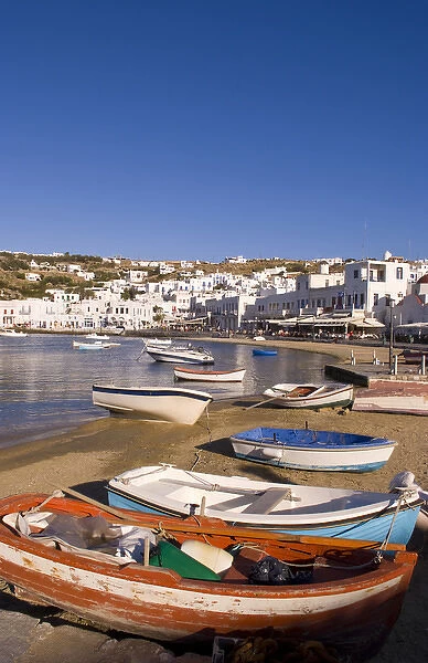 The harbor town with colorful fishing boats moored at the small harbor, Mykonos