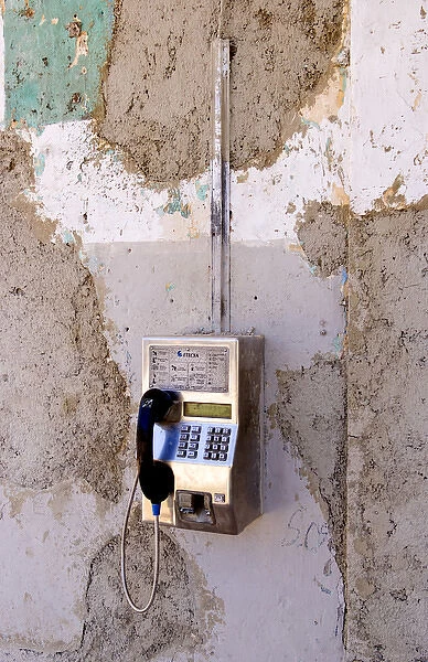 Havana capitol city of Cuba closeup of peeled paint and old pay phone in Lawton