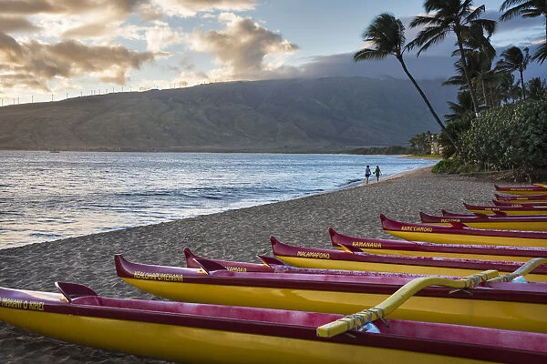Hawaii, Maui, Kihei. Traditional Hawaiian outrigger canoes in the foreground with