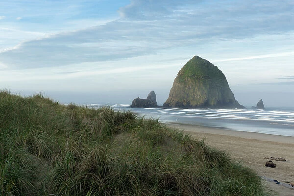 Hay Stack Rock on the sandy beach at Cannon Beach, Oregon