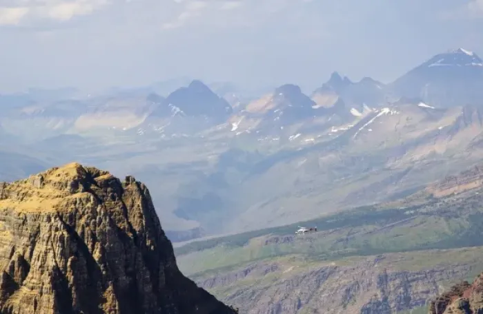 Framed Print : Helicopter takes tourists for ride near Logan Pass in Glacier National Park in Montana