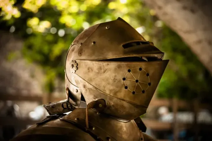 Framed Print : The helmet and shoulder piece of a medieval knights armor