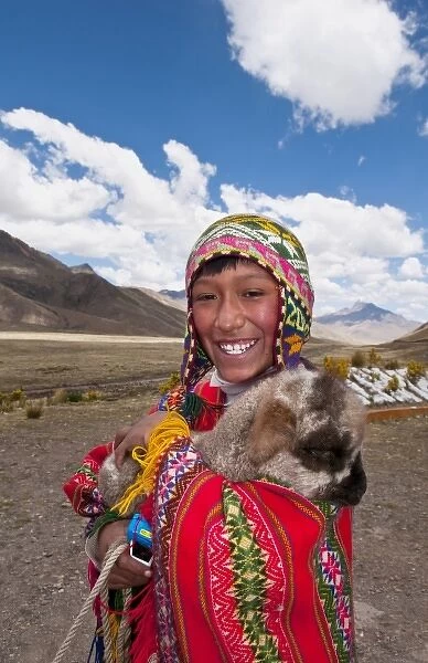 High peak at 13, 000 feet of La Raya Peru with young boy with llama portrait (MR)