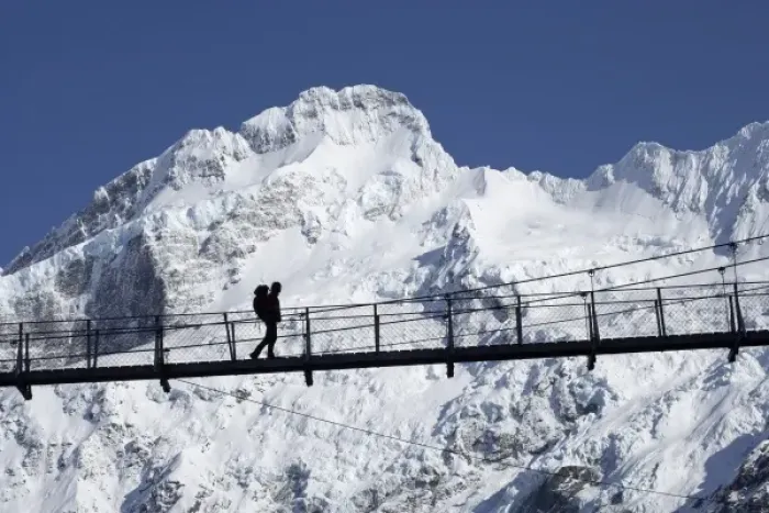 Framed Print : Hiker on Hooker River Footbridge & Mt Sefton, Aoraki  /  Mt Cook National Park, Canterbury