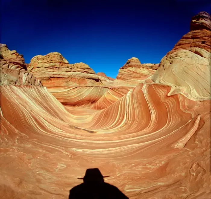 Framed Print : Hiker in the Wind and water eroded Navajo sandstone in Coyote Buttes North, Paria Framed Print : Hiker in the Wind and water eroded Navajo sandstone in Coyote Buttes North, Paria