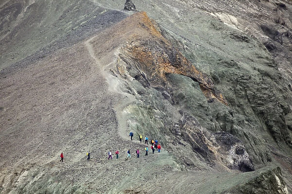 Hikers on trail up mountain, Iceland