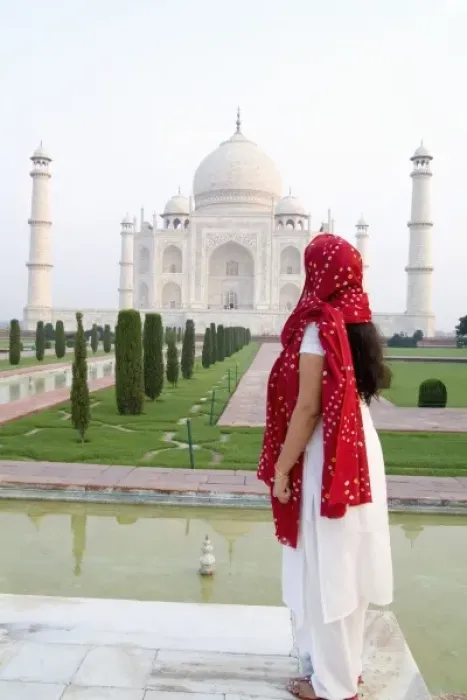 Framed Print : Hindu woman with colorful sari veil in the quiet peaceful Taj Mahal one of the wonders