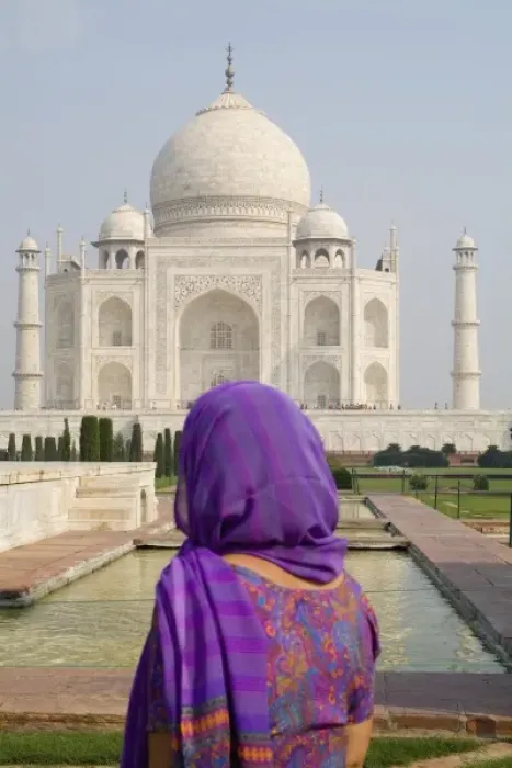 Framed Print : Hindu woman with colorful sari veil in the quiet peaceful Taj Mahal one of the wonders
