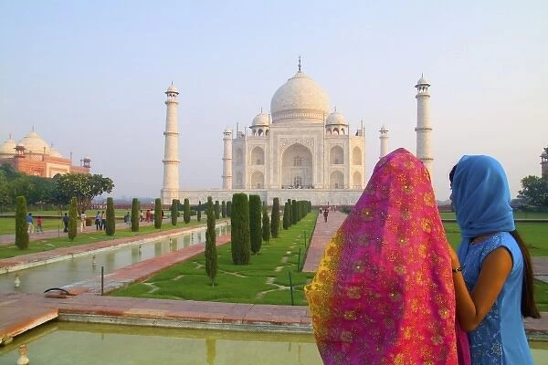 Hindu women with colorful veils in the quiet peaceful Taj Mahal one of the wonders