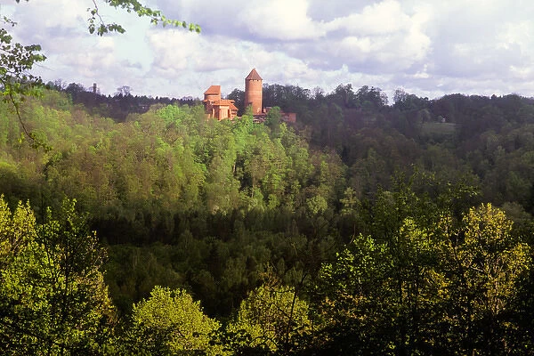 Historic Turaida Castle on the lushly forested banks of the Gauja River in the Gauja National Park