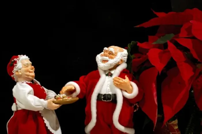 Framed Print : Holiday still life. Simpich Caracter Doll, Mr. & Mrs. Claus with cookie tray. Property released