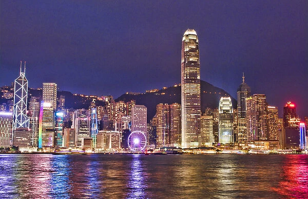 Hong Kong China skyline harbour night with new Ferris Wheel in city skyscrapers