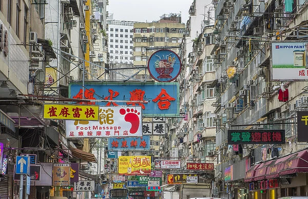 Hong Kong China traffic Kowloon Woosung Street with signs overhanging street