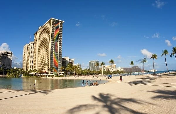 Honolulu, Hawaii. Lake and palm tree shadow of Rainbow Tower of Hiltons Waikiki