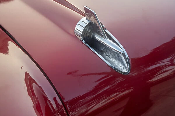 Detail of hood ornament of red 57 Chevrolet Bel Air in Habana, Havana, Cuba