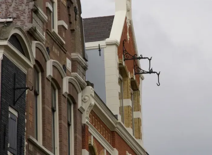 Framed Print : Hooks hanging from brick building in Amsterdam for pully system Framed Print : Hooks hanging from brick building in Amsterdam for pully system