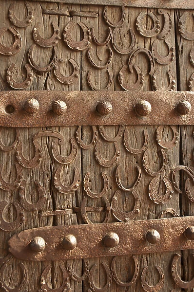 Horseshoes decorate a wooden door, Jama Masjid, Fatehpur Sikri, Uttar Pradesh, India