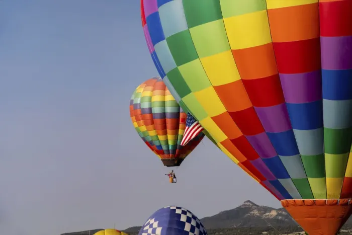 Framed Print : Hot air balloon bringing color to the sky. (Editorial Use Only)