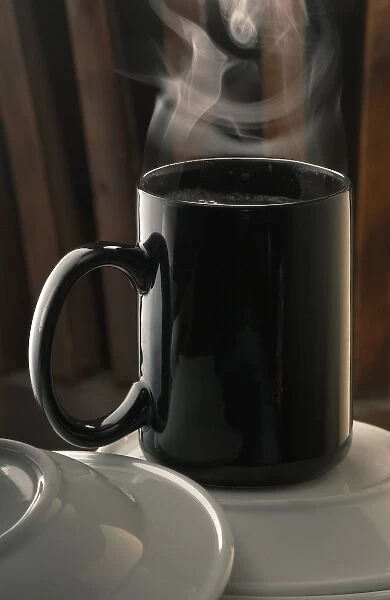 A hot beverage in a black mug