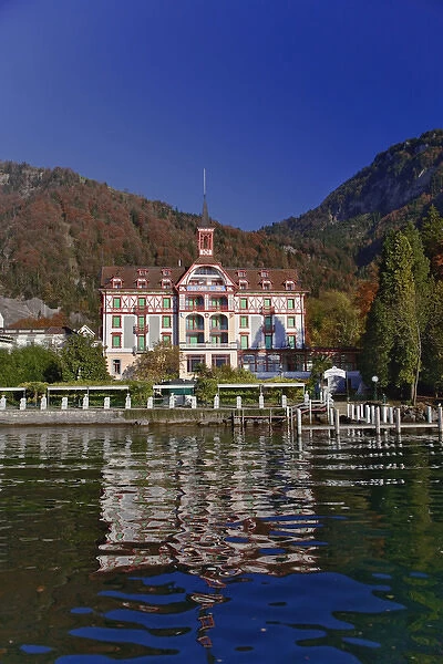 Hotel in autum along shore of Lake Lucerne from sightseeing boat, Lucerne, Switzerland