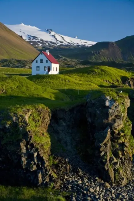 Framed Print : House near basaltic columns with Snaefellsjokull Volcano in the background Framed Print : House near basaltic columns with Snaefellsjokull Volcano in the background