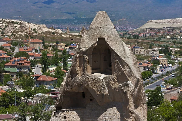 Houses carved into rock formation, Goreme, Cappadocia, Turkey
