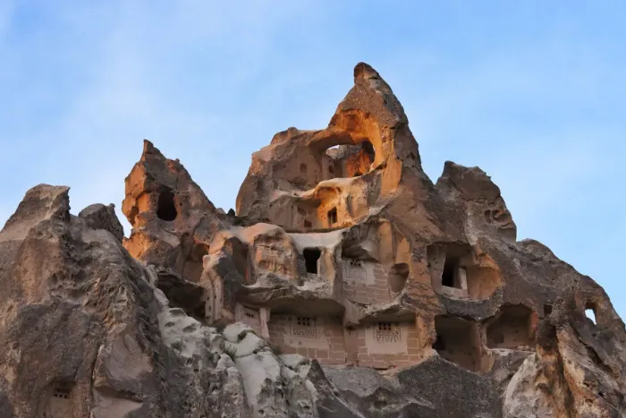 Framed Print : Houses carved into rock formation in Goreme at sunset, Cappadocia, Turkey Framed Print : Houses carved into rock formation in Goreme at sunset, Cappadocia, Turkey