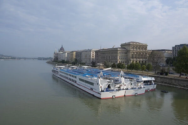 Hungary, Budapest. Viking Riverboats docked along the Pest side of the Danube River