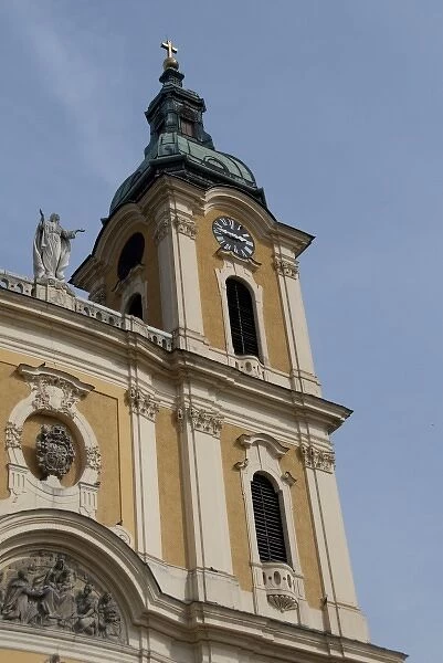 Hungary, Kalocsa. Historic baroque Kalocsa Cathedral, exterior. Bell tower with clock