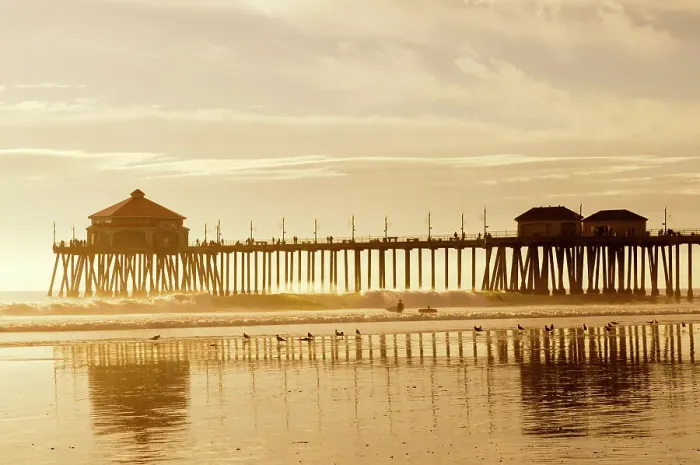 Framed Print : The Huntington Beach Pier and surfers at sunset. Huntington Beach, California Framed Print : The Huntington Beach Pier and surfers at sunset. Huntington Beach, California