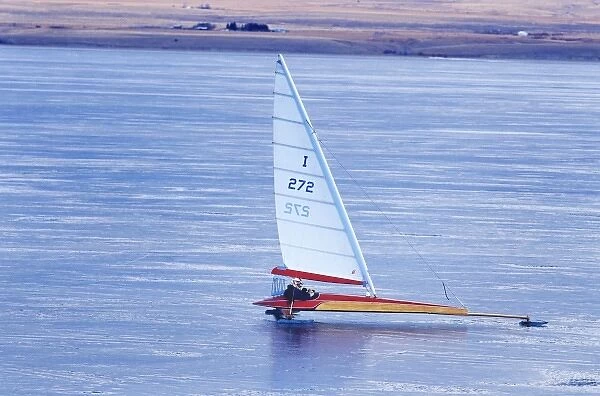 Ice boat sailing on ice at Canyon Ferry Lake near Townsend, Montana