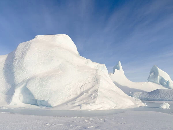 Iceberg frozen into the sea ice of the Melville Bay, near Kullorsuaq in the far north of